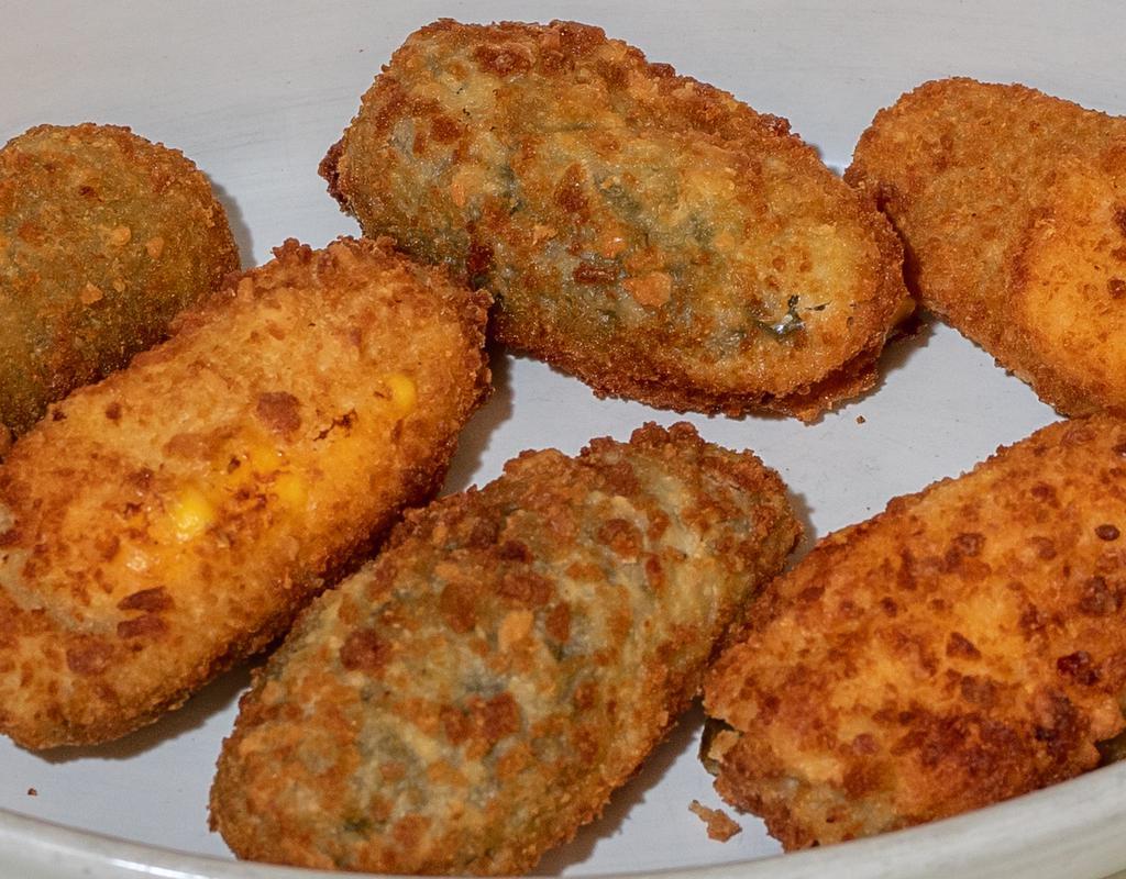 Jalapeno Poppers   · 6 pieces. Comes with cream cheese or cheddar cheese and choice of house-made marinara or ranch (4 oz.).