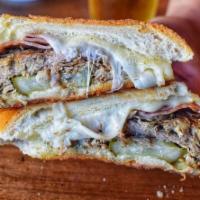 Cuban Sandwich · Marinated Pork loin, ham, swiss, pickles, pressed bread.