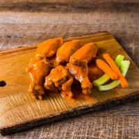Wings · Your choice of sauce. Add carrot and celery for an additional charge.
