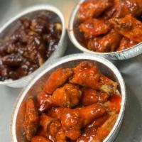 Wings · Our plump juicy, bone-in wings are available in Buffalo, or barbeque and served with homemad...