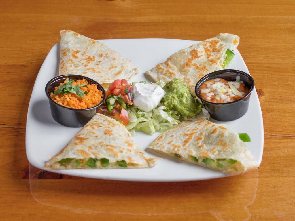 Fajita Quesadilla · Flour tortilla filled with shredded cheese, marinated steak or grilled chicken onions, tomatoes, bell peppers and mushrooms served with a side salad rice and choice of beans.