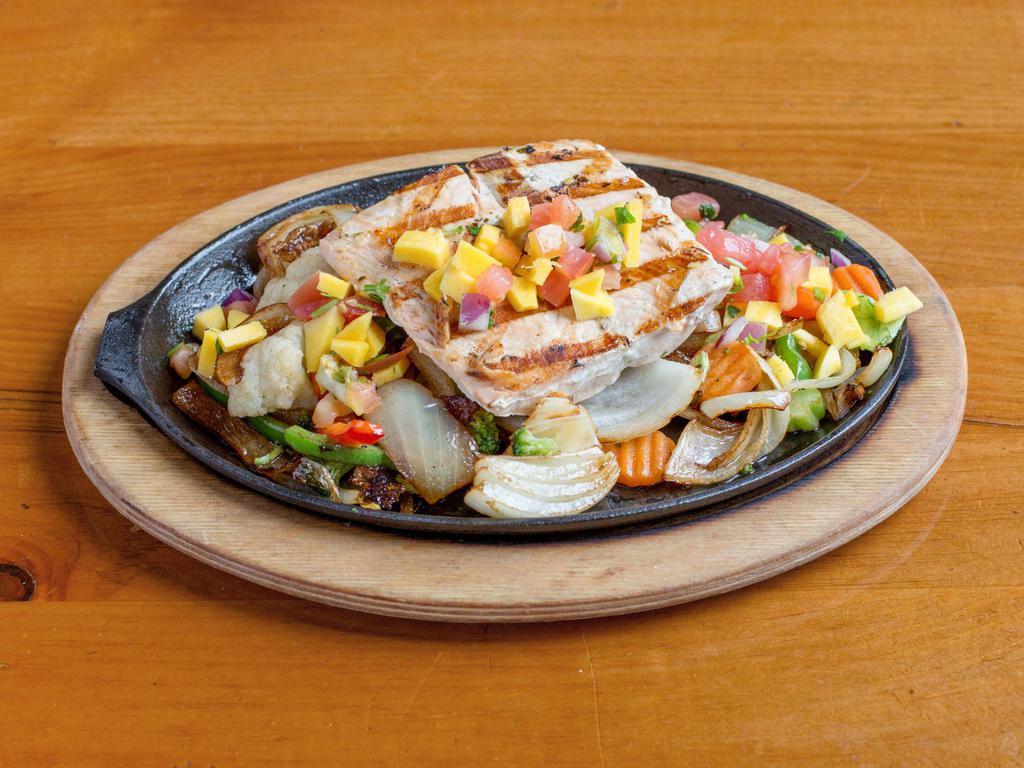 Salmon Fajitas · Fresh grilled salmon fillet with onions, bell peppers, tomatoes,mushrooms
broccoli and caulflower topped with pico de gallo.