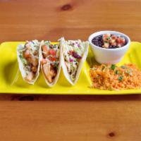 Shrimp Cancun Tacos · 3 flour tortilla tacos topped with shredded cheese served with rice, lettuce, pico de gallo ...