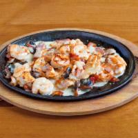 Pollo Texano · Grilled chicken strips, shrimp, bacon and mushrooms covered with cheese
dip served with rice...
