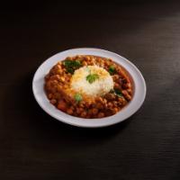 Channa Masala · Garbanzo beans cooked with spices, onion and tomato gravy.
