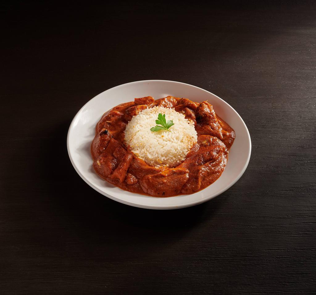 Chicken Tikka Masala · Chef's specialty. Tender pieces of chicken marinated in special Indian spices and tossed with bell peppers.
