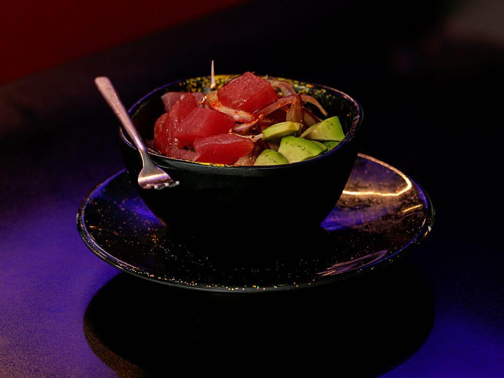 Poke Tuna · Raw. Tuna chunks, avocado, onion, green onion, chef special sauce and sesame seed.