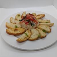 Rosemary Hummus · Rosemary garlic hummus with pickled red onion sauté, roasted garlic crostini