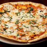 Margherita Pizza · Mozzarella blend, pomodoro sauce and fresh basil.