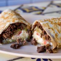 King Steak Burrito · Carne asada. Includes lettuce, tomato, cheese, sour cream, hot sauce & beans.