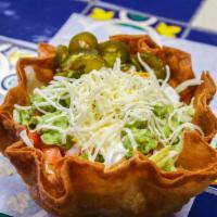 Steak Taco Salad · Flour Tortilla shell , lettuce, tomato, sour cream, shredded cheese, nacho cheese, guacamole...