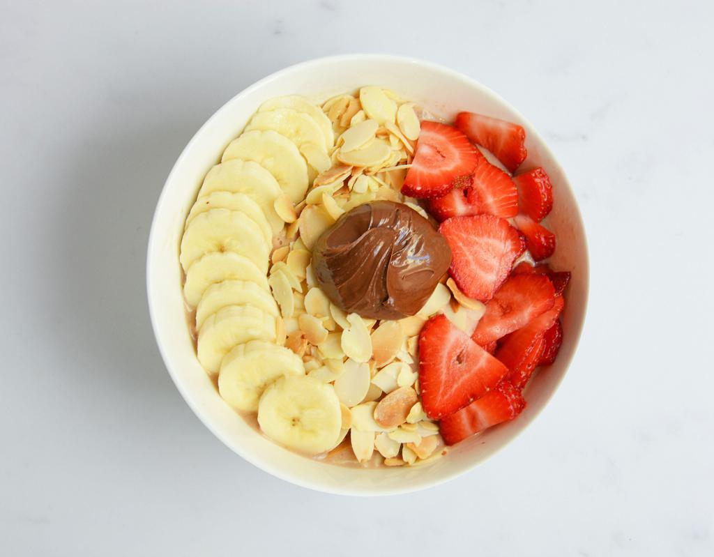 Nutella Acai Bowl · Almond milk, bananas, acai, Nutella, peanut butter. Topped with toasted sliced almonds, bananas, strawberries and Nutella.