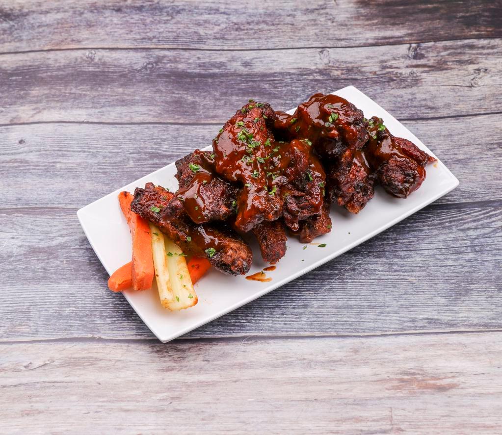 Amazing Slow Smoked Wings · Hard wood smoked, fried to a crispy finish, tossed in choice of sauces with a blue cheese or ranch dressing.