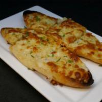 Cheese Garlic Bread · Crusty Italian bread, provel cheese blend, garlic butter and Tomato Bisque.
