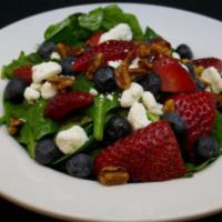 Spinach Salad · Fresh strawberries, candied pecans, goat cheese, blueberries and raspberry vinaigrette.