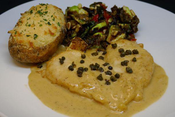 Veal Picatta · Twice-baked potato, Brussels sprouts, capers, lemon, white wine and touch of cream.