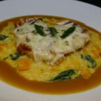 Chicken Saltimbocca · Prosciutto, Provelone cheese, sage, butternut risotto, spinach and white wine demi-glaze.
