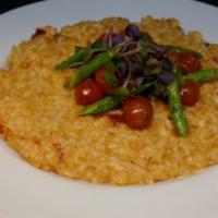 Lobster Risotto · Arborio rice with lobster stock, lobster meat, asparagus, roasted tomatoes and micro greens.