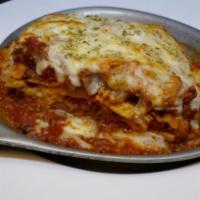 Baked Lasagna · Ground beef, ricotta, mozzarella, Parmesan and Bolognese.