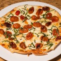 Margherita Pizza · Tomato, basil, fresh mozzarella and olive oil. No sauce.