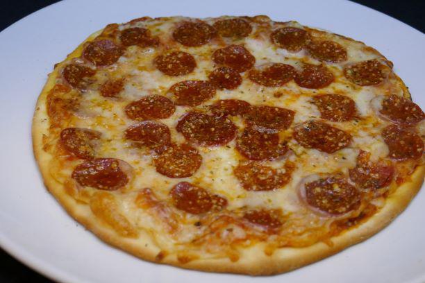 Pepperoni Pizza · Pizza sauce, Provel cheese mix, oregano and Parmesan.