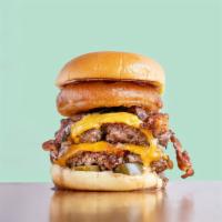 Diesel Burger · Double patty, cheddar cheese, bacon, jalapenos, caramelized onions, onion rings, BBQ sauce, ...