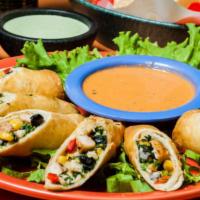 Southwest Eggrolls · Flour tortillas filled with grilled chicken, black beans, spinach, corn, jalapenos, jack che...