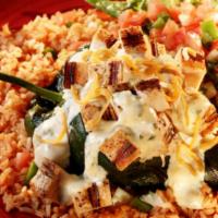 Chicken Stuffed Poblano Pepper · Grilled poblano pepper stuffed with Monterey Jack cheese and diced chicken fajitas, topped w...