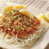 Pancit Palabok · Thick rice noodle in a delicious shrimp squid and ground pork sauce, garnished with garlic b...