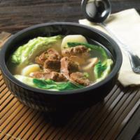 Nilagang Baka · Tender beef shanks and ribs in a flavorful soup, with greens, potatoes, and peppercorn. A be...