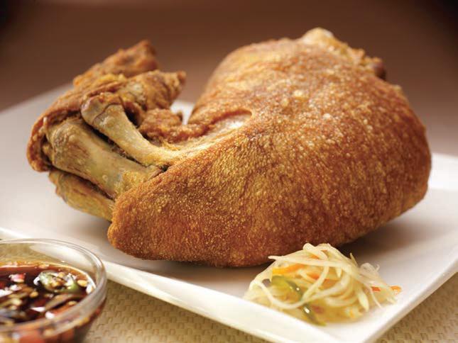 Crispy Pata (Crispy Pork hock) · Premium pork hock simmered in a special marinade and deep fried to perfection.  Served with soy vinegar dipping sauce.  A treat!