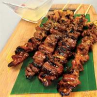 Pork BBQ Skewer · Marinated in a special tangy mildly sweet & spicy sauce & speared in a bamboo skewer, grille...