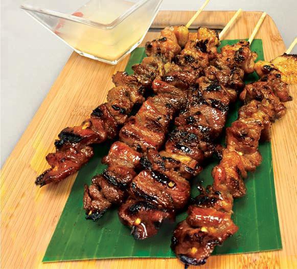 Pork BBQ Skewer · Marinated in a special tangy mildly sweet & spicy sauce & speared in a bamboo skewer, grilled to perfection.