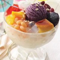 Halo-Halo · A blend of refreshing tropical fruit preserves, beans, and milk in shaved ice.  Topped with ...