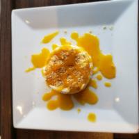 Mango Float · Frozen whipped milk cream topped with caramelized fresh mango fruit, sprinkled with graham c...