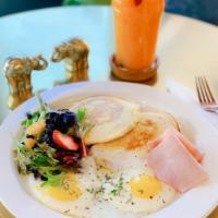 King's Complete Breakfast · 2 eggs any style, pancakes and side of ham or bacon. Served with fruit and salad.