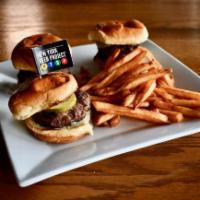 Magic Castle Sliders · Cheeseburger sliders with minced onions and dill pickles.