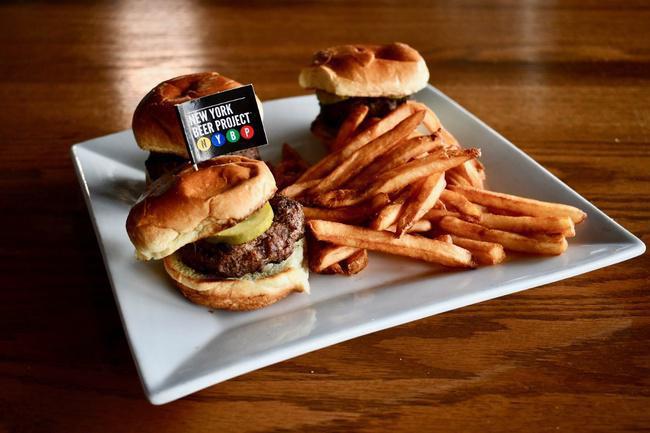 Magic Castle Sliders · Cheeseburger sliders with minced onions and dill pickles.