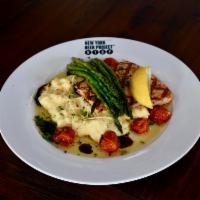 South Street Salmon · Fresh Atlantic salmon grilled to perfection and served over creamy polenta with parmesan che...