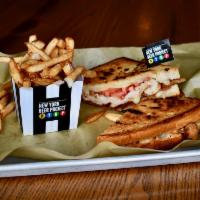 Love Child Panini · Fall in love with this delicious panini piled high with thinly sliced turkey, Swiss cheese, ...