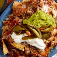 Nachos Lito · Crunchy chips topped with beans, sauce, lots of melted cheese, sour cream, guacamole and jal...