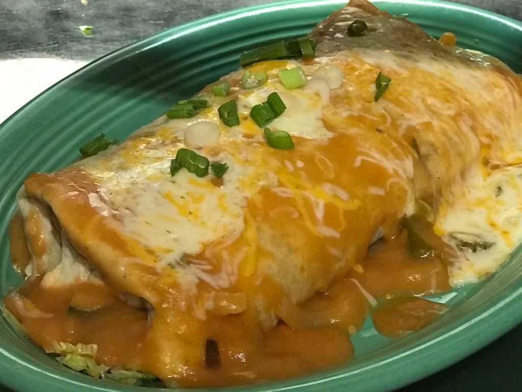 Veggie Burrito Lito · Stuffed with sauteed zucchini, onions, mushrooms and bell peppers with lettuce, tomato, beans, sour cream and cheese. Topped with ranchera sauce and cheese.