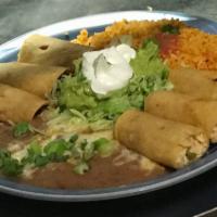 Taquitos Rancheras · 3 hand rolled shredded beef or chicken taquitos, served with guacamole, sour cream, rice and...
