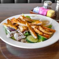 Grilled Chicken Salad · Fresh-grilled chicken breast, romaine, tomato, red onions, green peppers, and mushroom.
