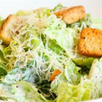 Caesar Salad · Romaine, Parmesan cheese, garlic croutons, served with Caesar dressing. Extras for an additi...