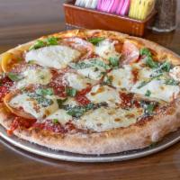 Margarita Pizza · Fresh mozzarella cheese, tomato, basil, garlic, glazed with extra virgin olive oil.