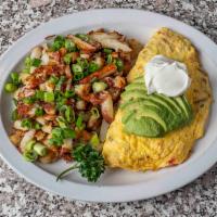 California Omelette · Our big, three-egg omelette stuffed with tomato, bacon, cheese, and sliced avocado, topped w...