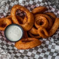 Beer Battered Onion Rings · Sweet Spanish onions thick-cut, double dipped in beer batter and fried crispy.