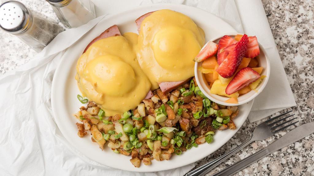 Eggs Benedict · With your choice of ham, sliced avocado or country sausage on a grilled English muffin, topped with poached eggs and hollandaise sauce.