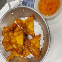 Crab Rangoon · Imitation crab meat with cream cheese, wrapped in wonton sheets and deep fried until golden ...